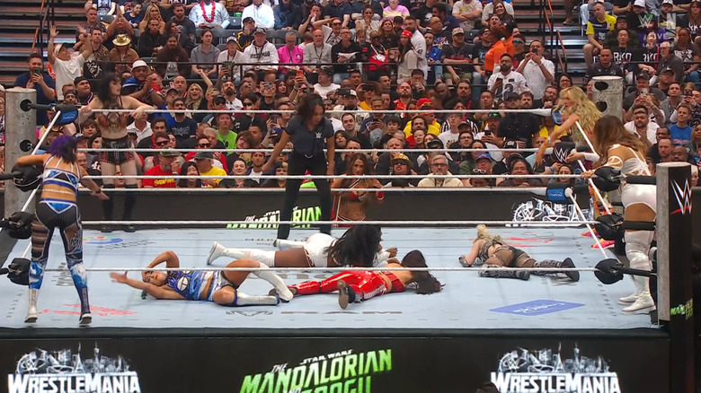 All eight women in and around the ring