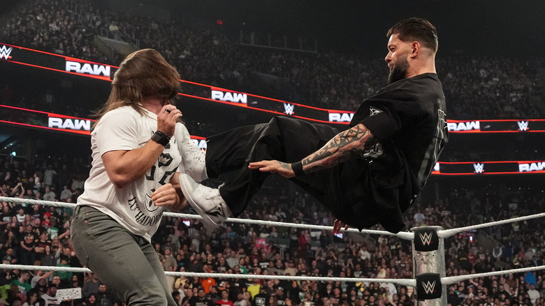 Finn Balor performing a drop kick on WWE Raw