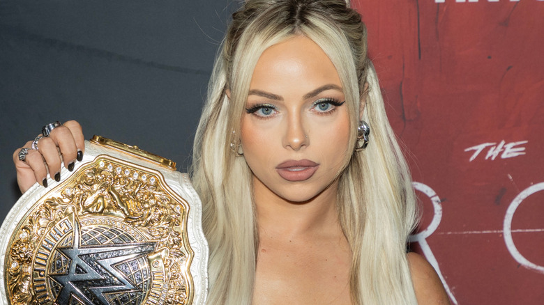 Liv Morgan holding the WWE Women's World Championship