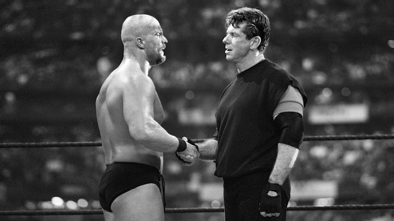Steve Austin shakes hands with Vince McMahon at WrestleMania X-Seven
