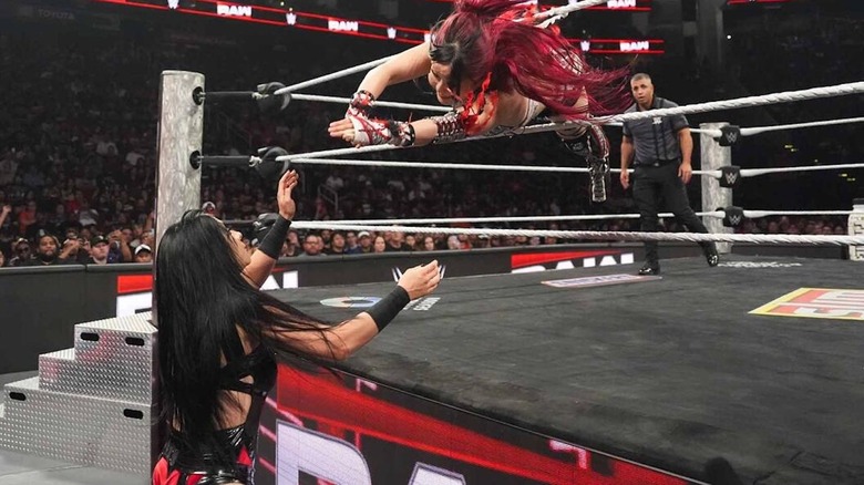 IYO SKY dives through the ropes onto Stephanie Vaquer on "WWE Raw"