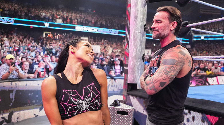 CM Punk and AJ Lee smile at each other