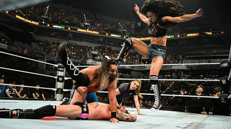 AJ Lee breaks up a pinfall on CM Punk by Stomping Seth Rollins' head at WWE Wrestlepalooza