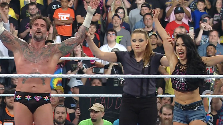 CM Punk and AJ Lee celebrate a victory.