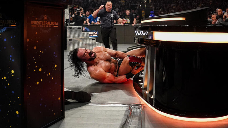 Drew McIntyre holding his leg