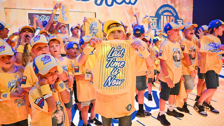 Kids in John Cena outfits accompany him for his entrance at WWE Wrestlepalooza
