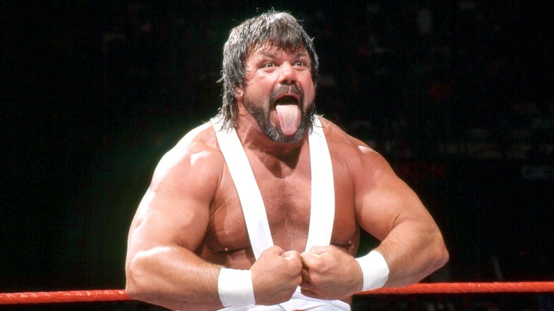 "Dr. Death" Steve Williams flexing with his tongue out