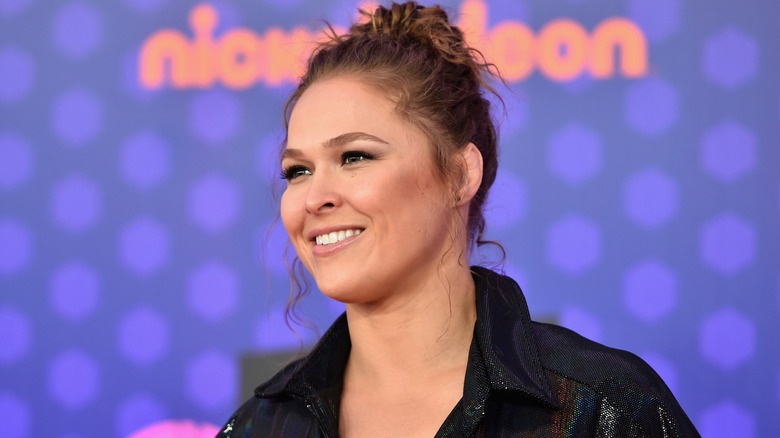 Ronda Rousey smiling on the red carpet for a Nickelodeon event