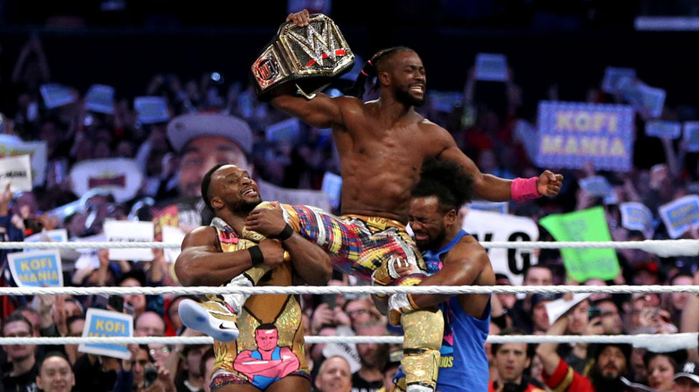 Kofi celebrates with The New Day