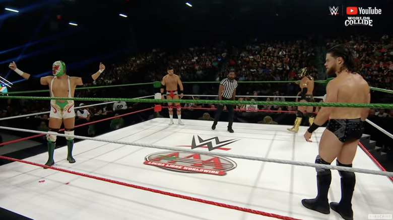 All four men staring each other down in the ring