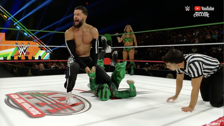 Balor and Iguana in the ring