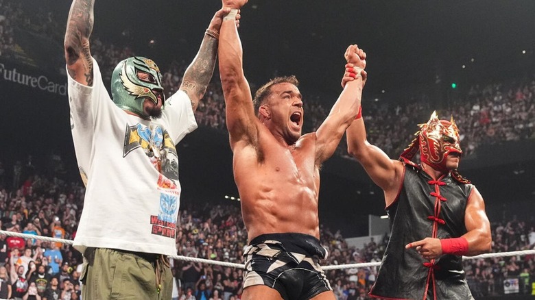 Chad Gable and Dragon Lee hold up the arms of Chad Gable in the ring after Gable defeated Rusev on the June 15, 2026 edition of 