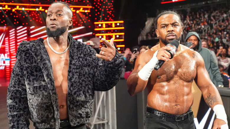 Kofi Kingston and Xavier Woods standing beside one another