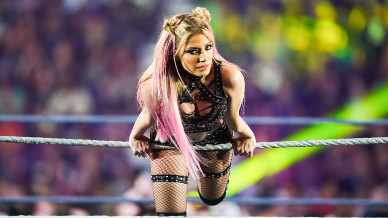 Alexa Bliss poses on the ring ropes