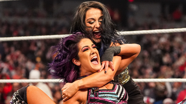 Bayley celebrating with Lyra Valkyria after winning on WWE Raw