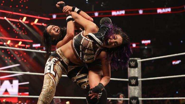 Bayley tries her hand at a shot for the WWE Women's IC Championship, but gets caught in an octopus hold by the retaining champion, AJ Lee.