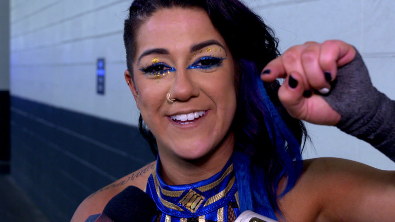 Bayley backstage pointing