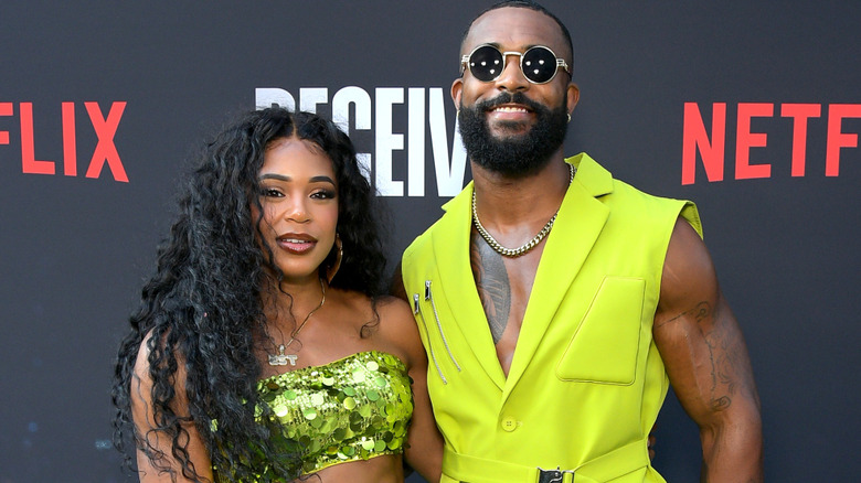Bianca Belair and Montez Ford standing beside one another