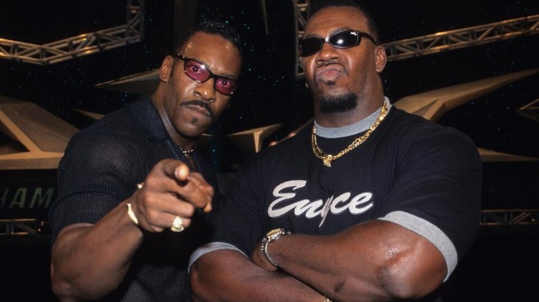 Booker T posing for a picture alongside his brother Stevie Ray during their WCW tenure.