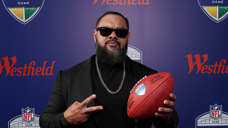 Bronson Reed holding a football