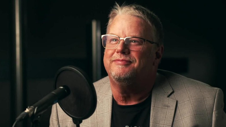 Bruce Prichard Speaks Into A Microphone