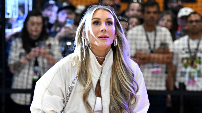Charlotte Flair preparing to shoot a basketball