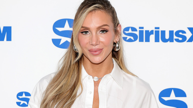 Charlotte Flair wearing silver earrings