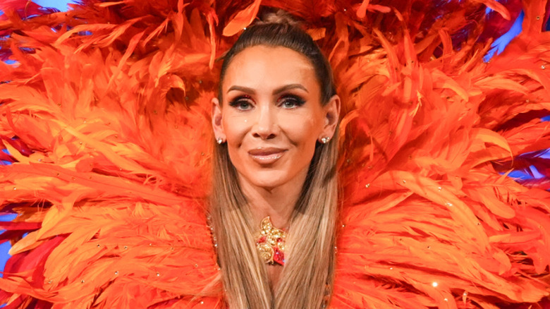 Charlotte Flair making her entrance with a lot of feathers