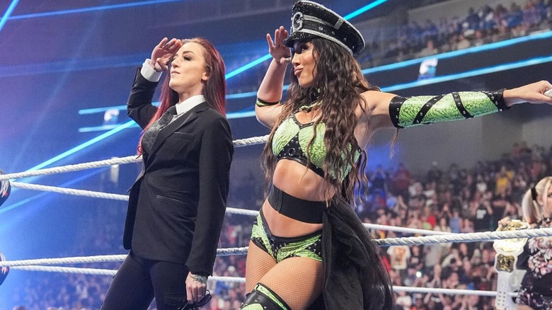 Chelsea Green and Alba Fyre salute toward the audience and the hard cam before a match on 