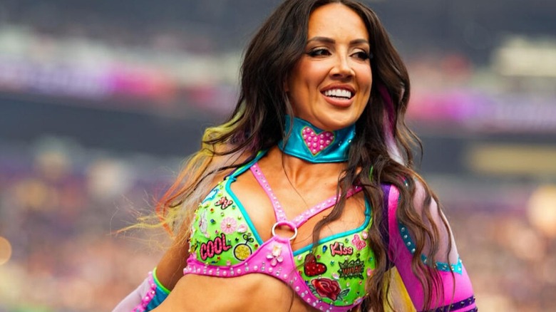 Chelsea Green leans over the ring ropes and smiles toward the crowd ahead of the ladder match for the interim WWE Women's Championship at WWE SummerSlam 2026.