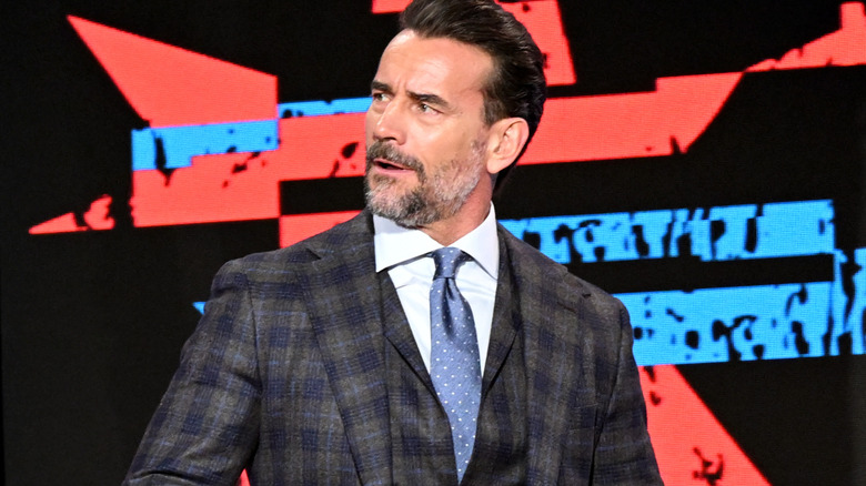 CM Punk is wearing a suit
