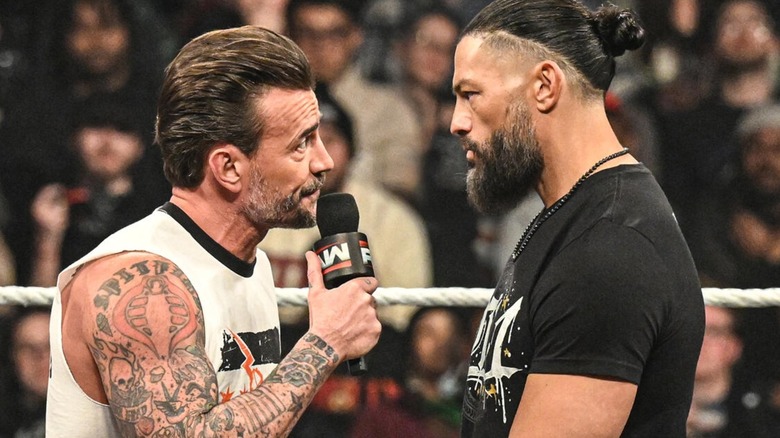 CM Punk and Roman Reigns in the ring