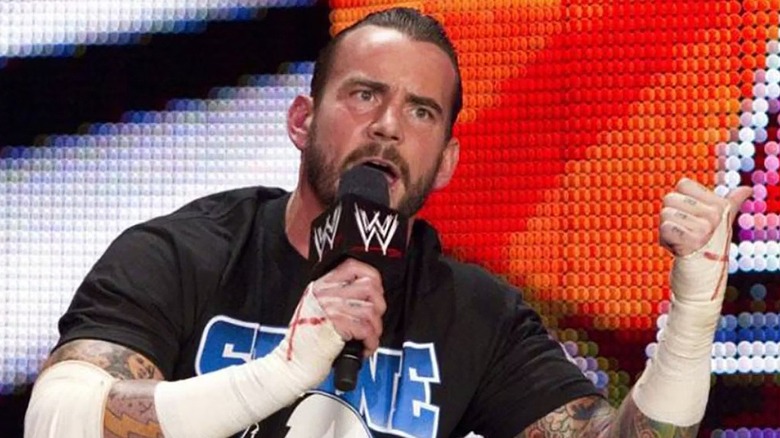 CM Punk pointing behind him during his "pipe bomb" promo.