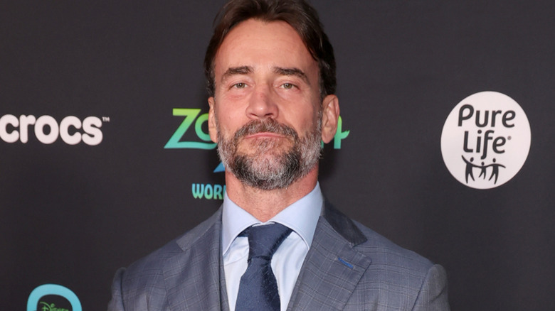 CM Punk is wearing a suit