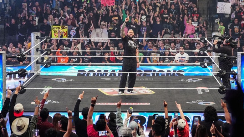 The fans follow Roman Reigns' lead by throwing up their "ones" in the air, acknowledging their "Tribal Chief" in WWE