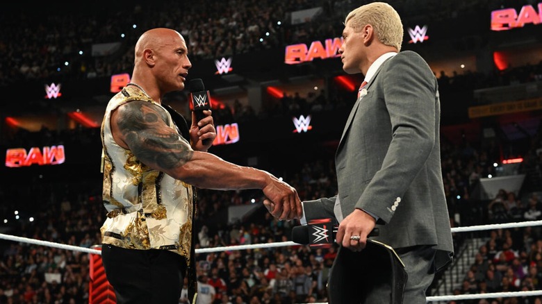 The Rock shaking Cody Rhodes hand after their feud during an episode of 