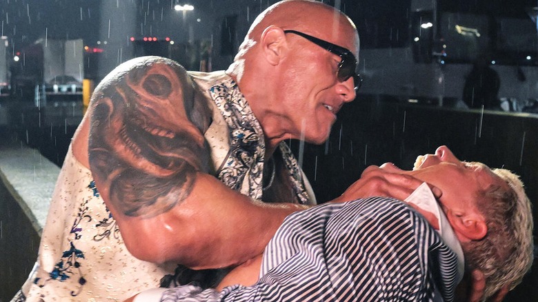 The Rock attacking Cody Rhodes in the parking lot during an episode of 