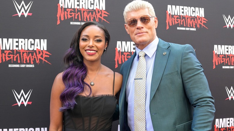 Brandi and Cody Rhodes smiling for a photo