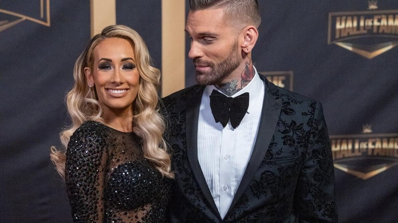 Carmella and real-life husband/WWE commentator Corey Graves pose together at the WWE Hall of Famer Ceremony