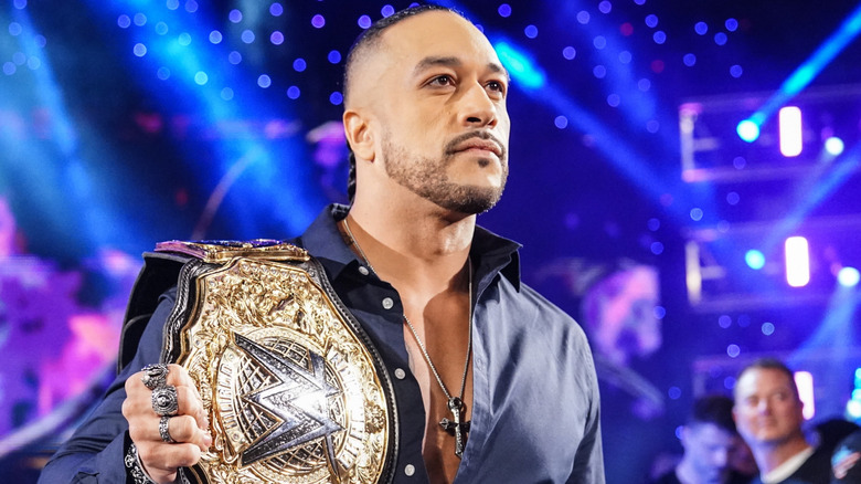 Damian Priest holding the WWE World Heavyweight Championship