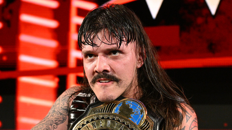 Dominik Mysterio holds onto his title for dear life