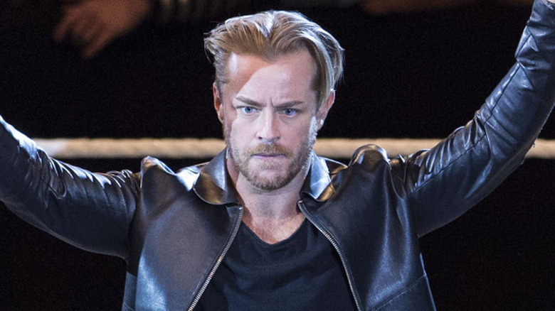 Drake Maverick raising both arms