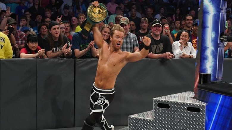 Former WWE star Drake Maverick runs around the ring with the WWE 24/7 Championship after winning it from Elias on an episode of 