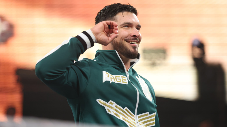 Ethan Page in a green jacket