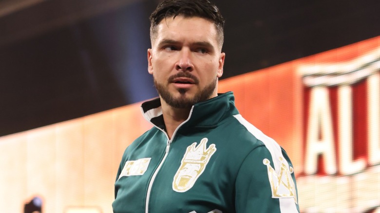 Ethan Page wearing a green jacket