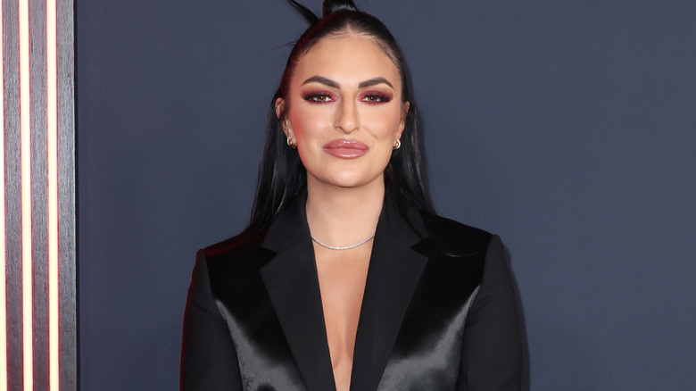 Sonya Deville wearing a black blazer
