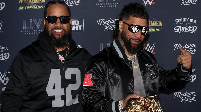 Jimmy Uso and Jey Uso are wearing sunglasses