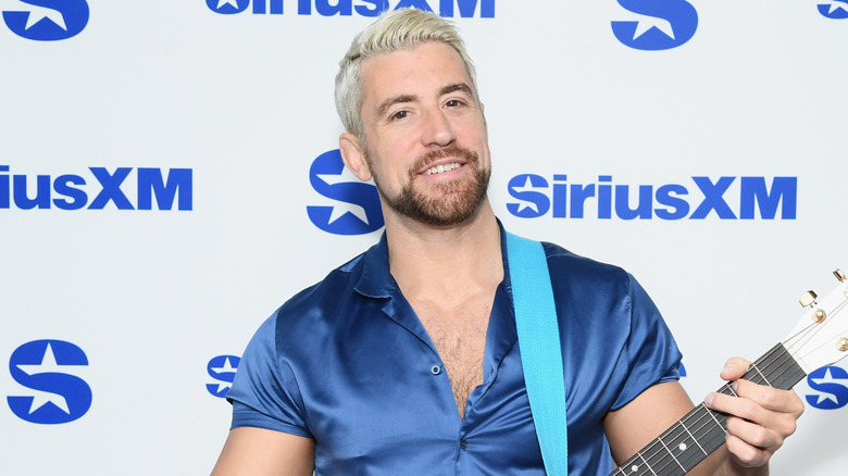 Joe Hendry wearing blue shirt at promotional event