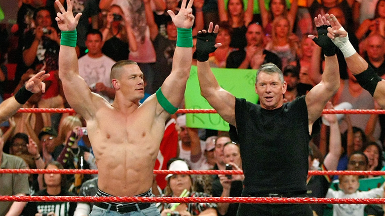 Wrestler Shawn Michaels, World Wrestling Entertainment Inc. Chairman Vince McMahon, and wrestlers John Cena and Triple H pose in the ring during the WWE Monday Night Raw show at the Thomas & Mack Center August 24, 2009 in Las Vegas, Nevada