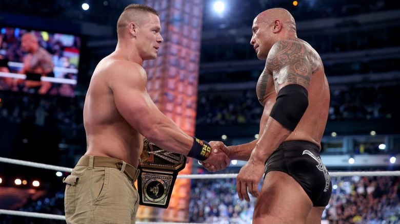 John Cena shakes The Rock's hand after successfully defending his WWE Championship at WrestleMania 29